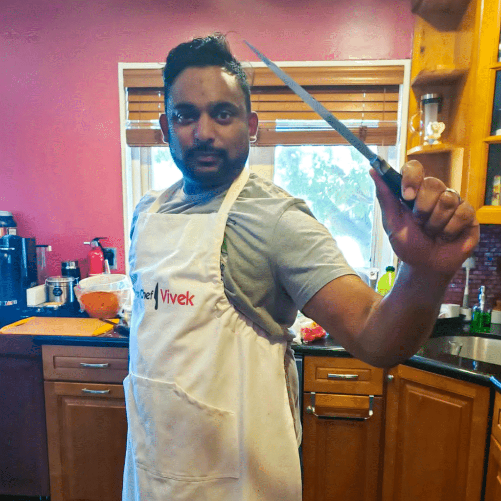 Vivek Sukumaran in kitchen with knife