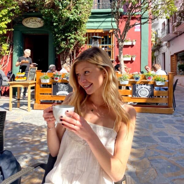 Emily Troy drinking coffee at a cafe