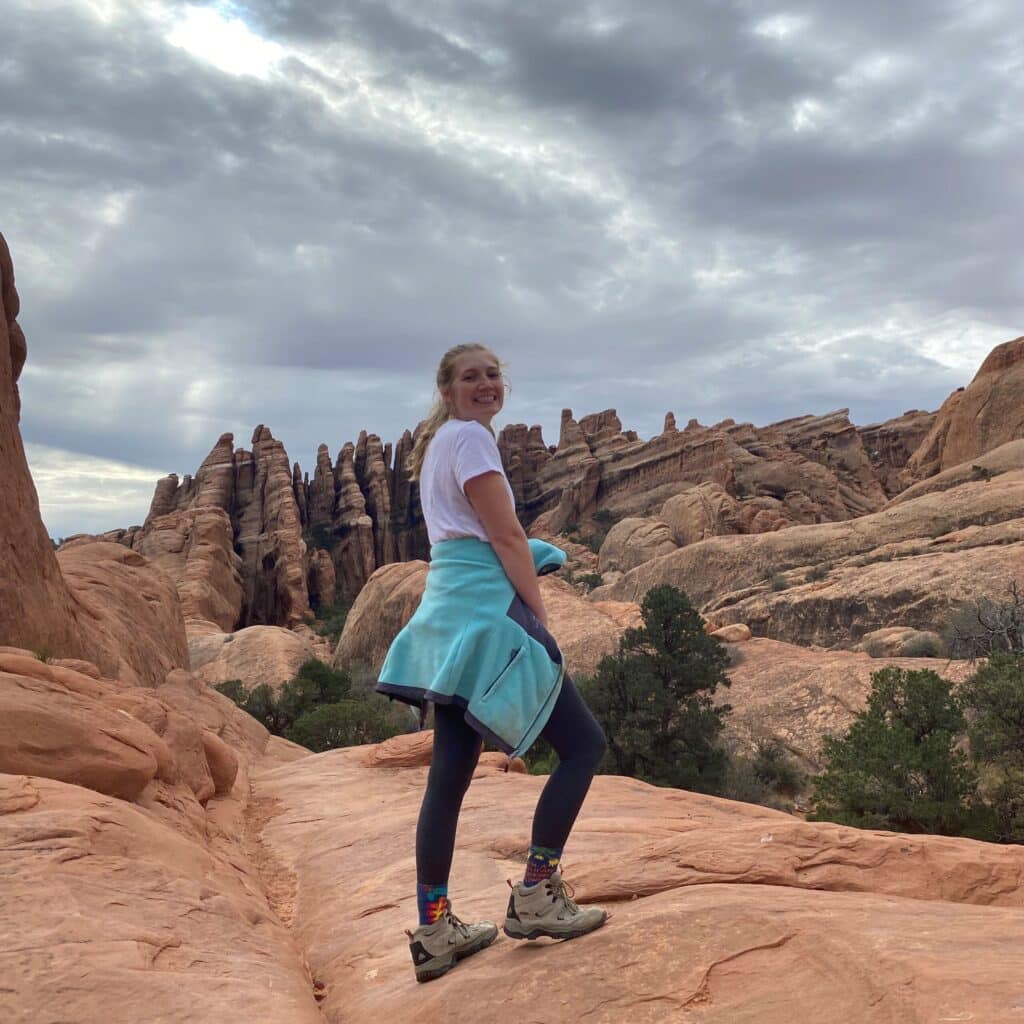 Emma Cole hiking on a mountain