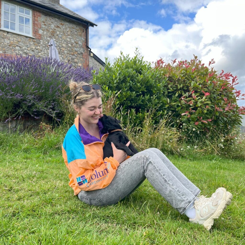 Evelyn Russo holding her dog outside