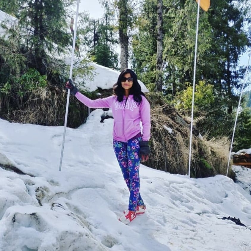 Foram Maniar standing on a snow mountain