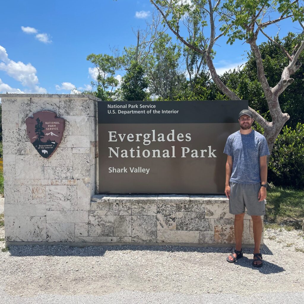 Harrison Deneka in front of Everglades National Park sign