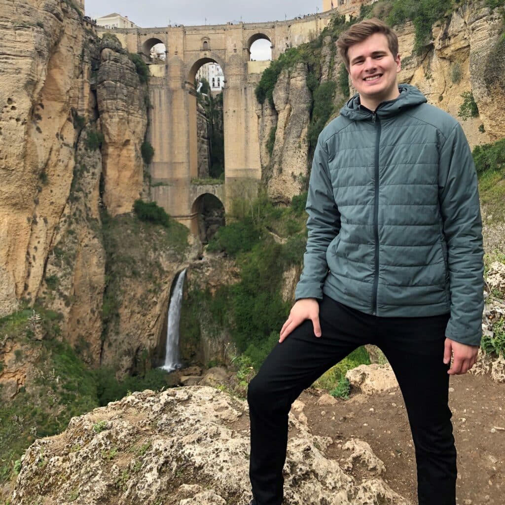 Harrison Deneka in front of the Puente Nuevo bridge – Ronda, Spain