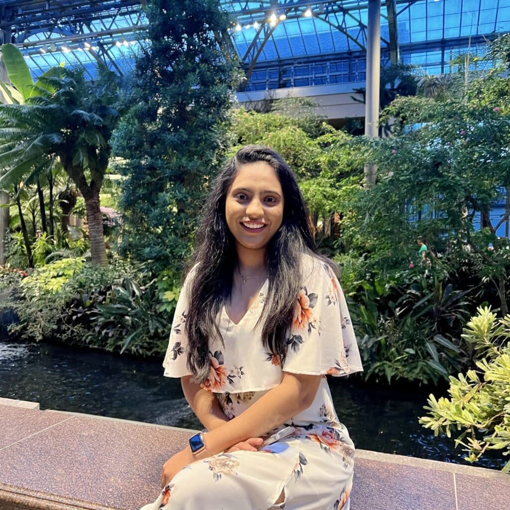 Helly Patel sitting inside a garden