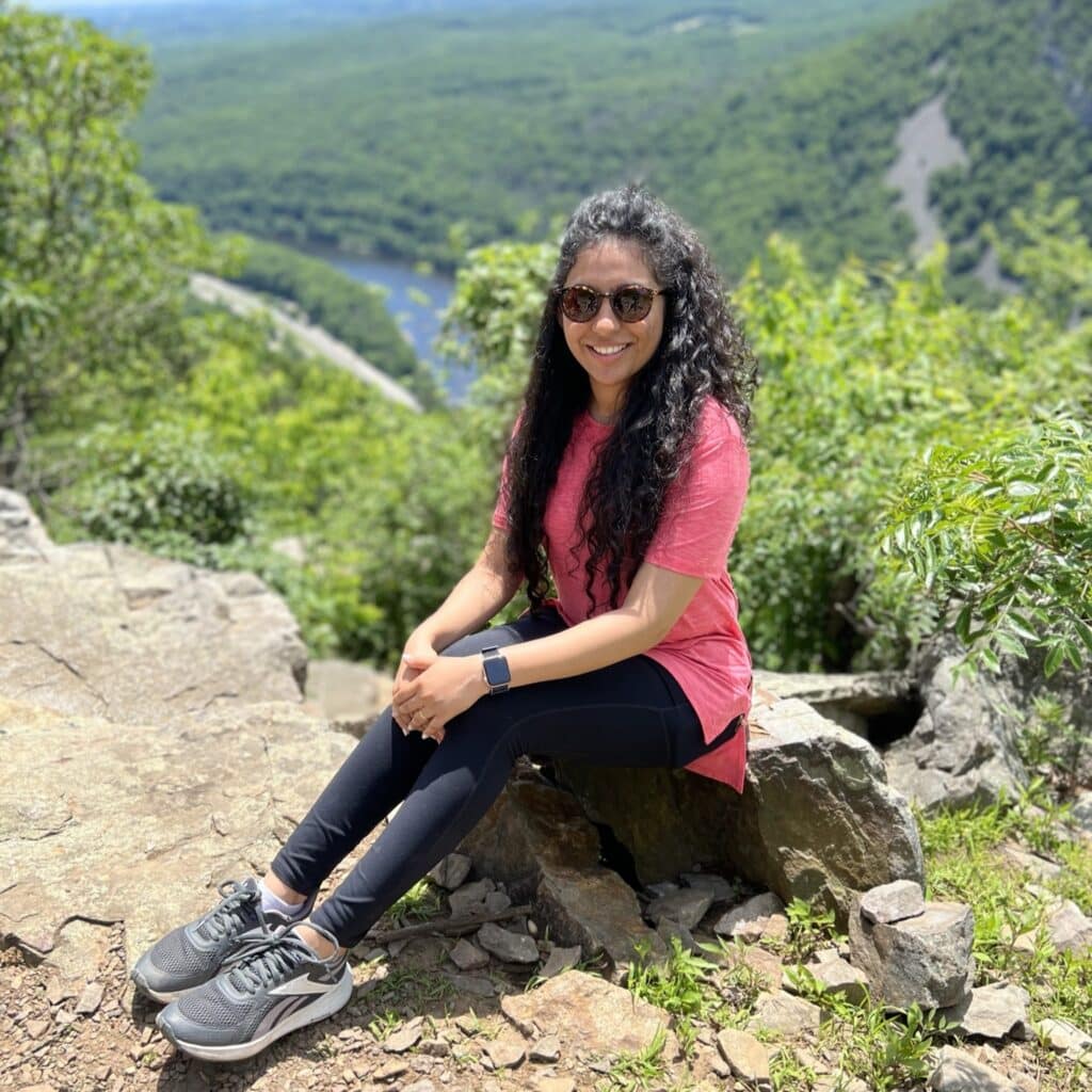 Helly Patel sitting on a mountain