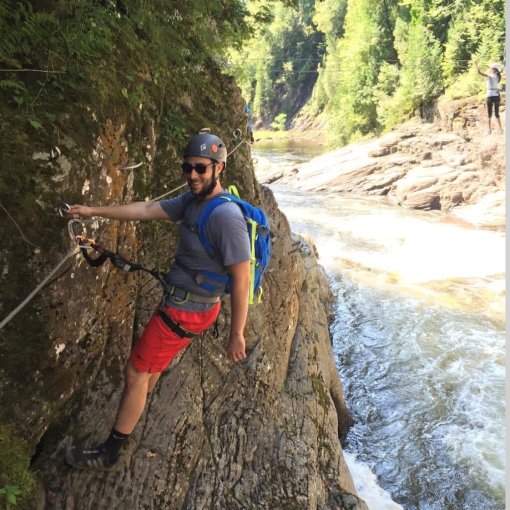 Jason Schwartz climbing in creek