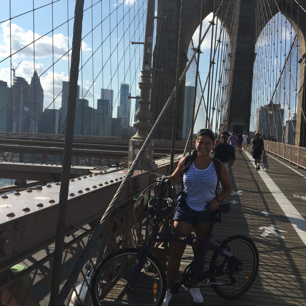 Jenniffer Ramirez with bike on Brooklyn Bridge