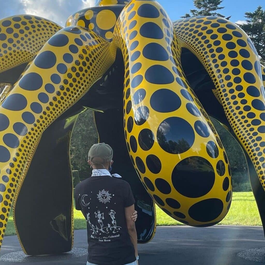 Josef Belle looking at an art sculpture