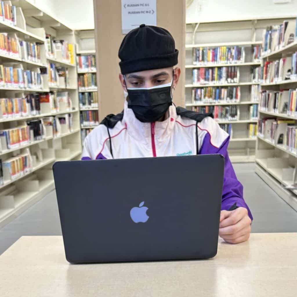 Josef Belle working in the library