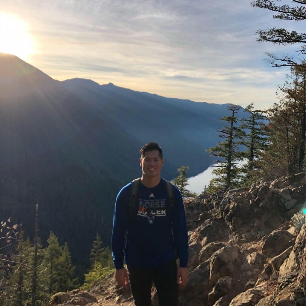 Justin Hoang hiking a mountain