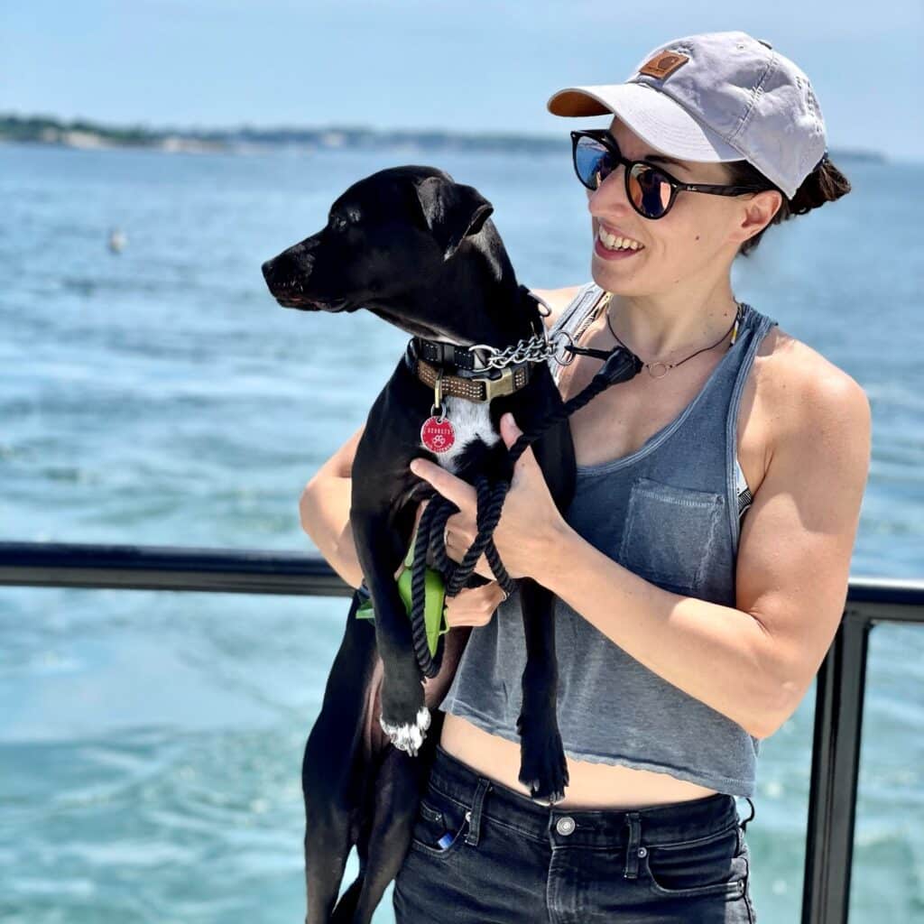 Kateri Virgilio with dog by beach