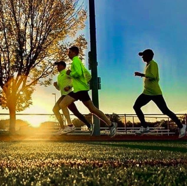 Michael Carroll running with two friends