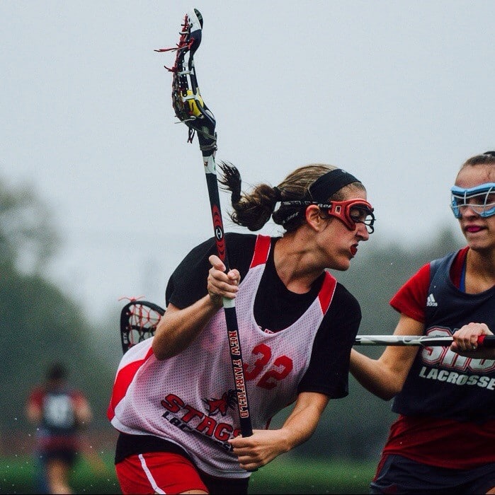 Mary Smyth playing lacrosse