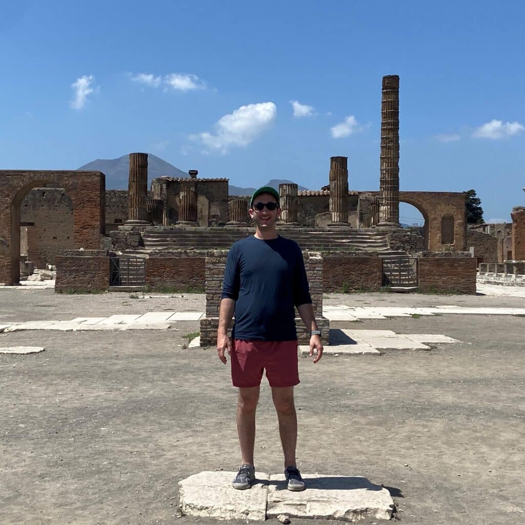 Matthew Klayman in front of ancient ruins