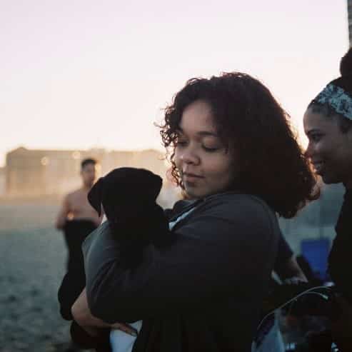 Melissa Brown outdoors holding dog