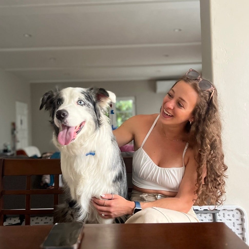 Mikayla Basil cuddling her dog