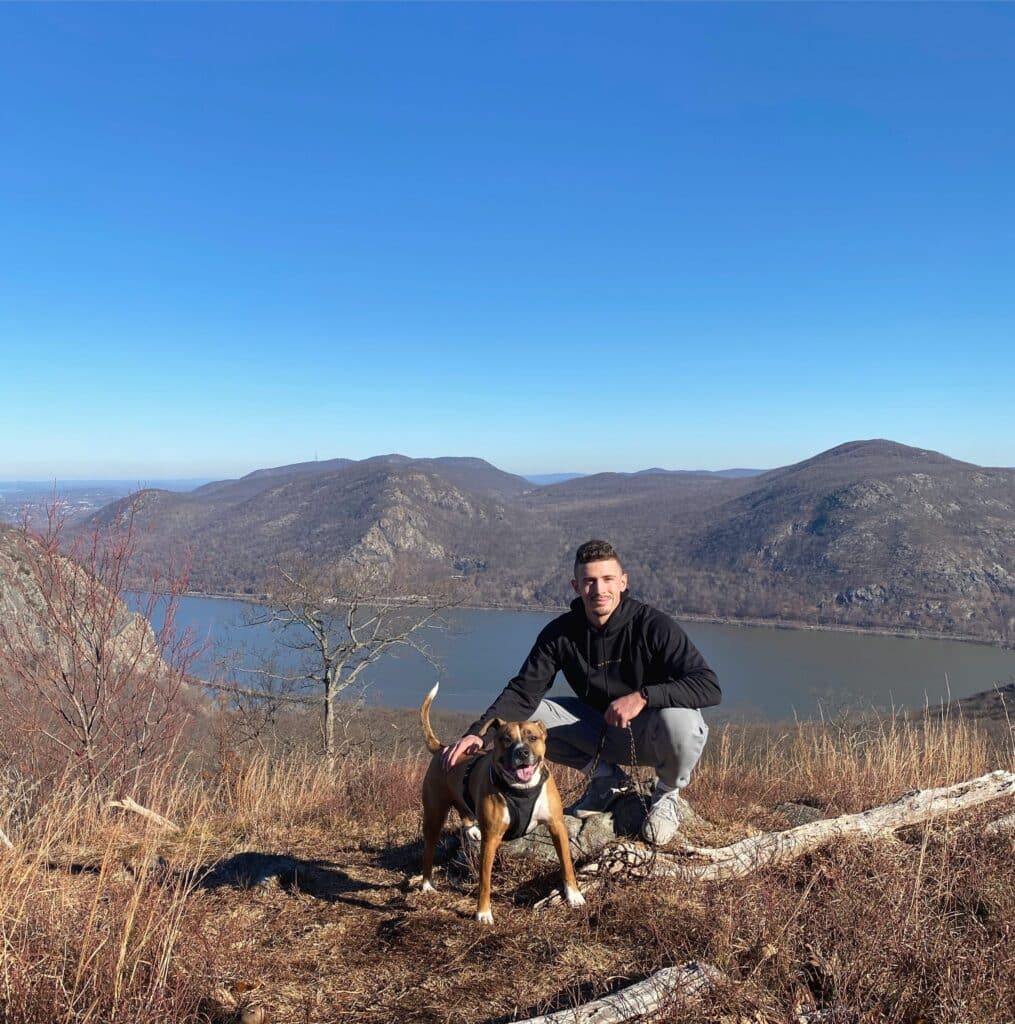 Mike Canino outdoor portrait on mountain with dog