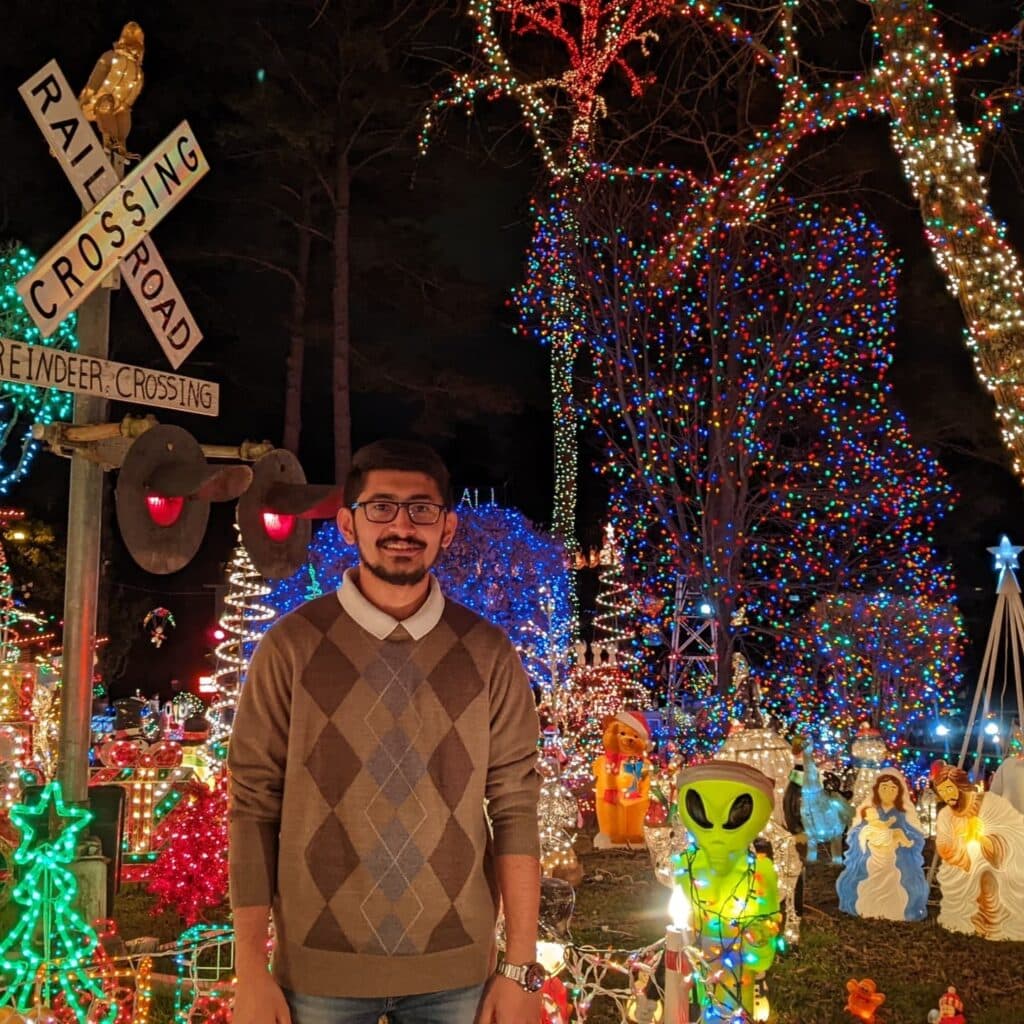 Mohit Vyas in front of Christmas decoration