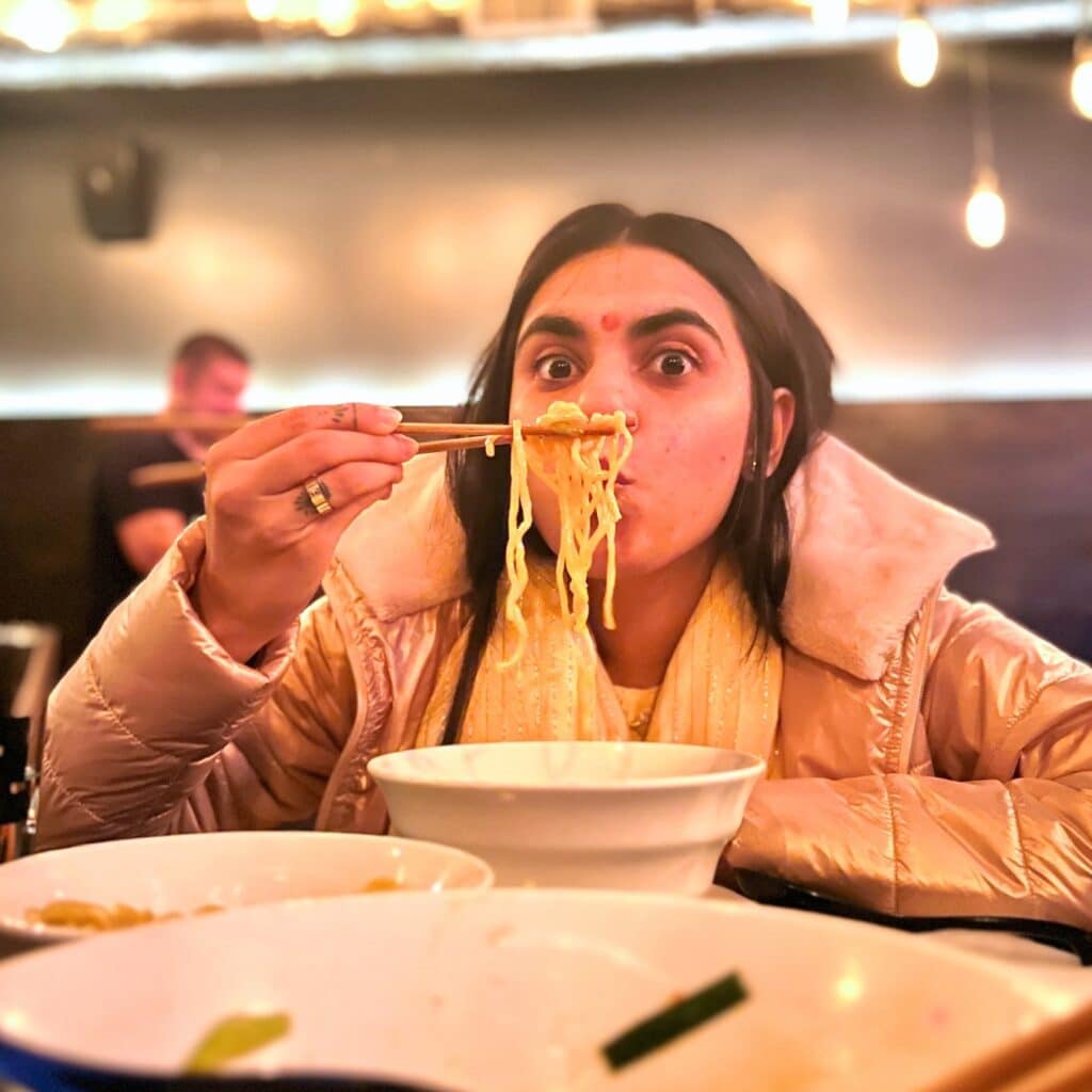 Nehal eating noodles