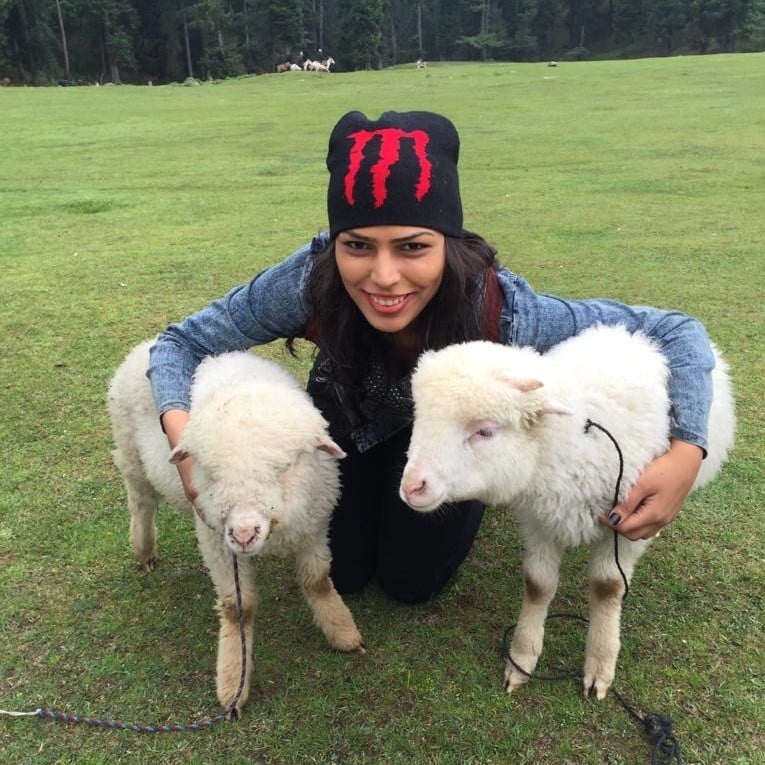 Nishi Shah with two goats