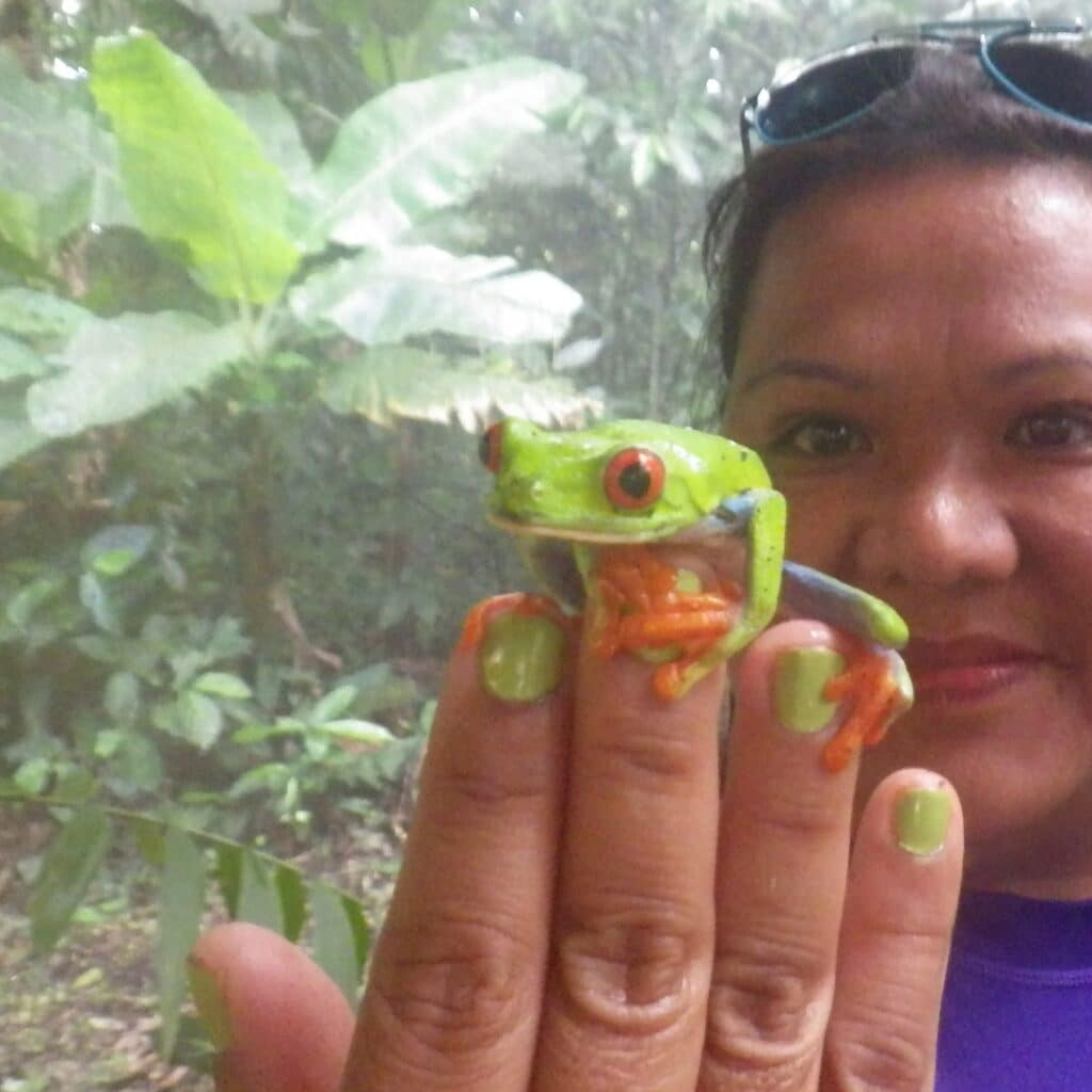 Polimarta Rubenstein holding a frog