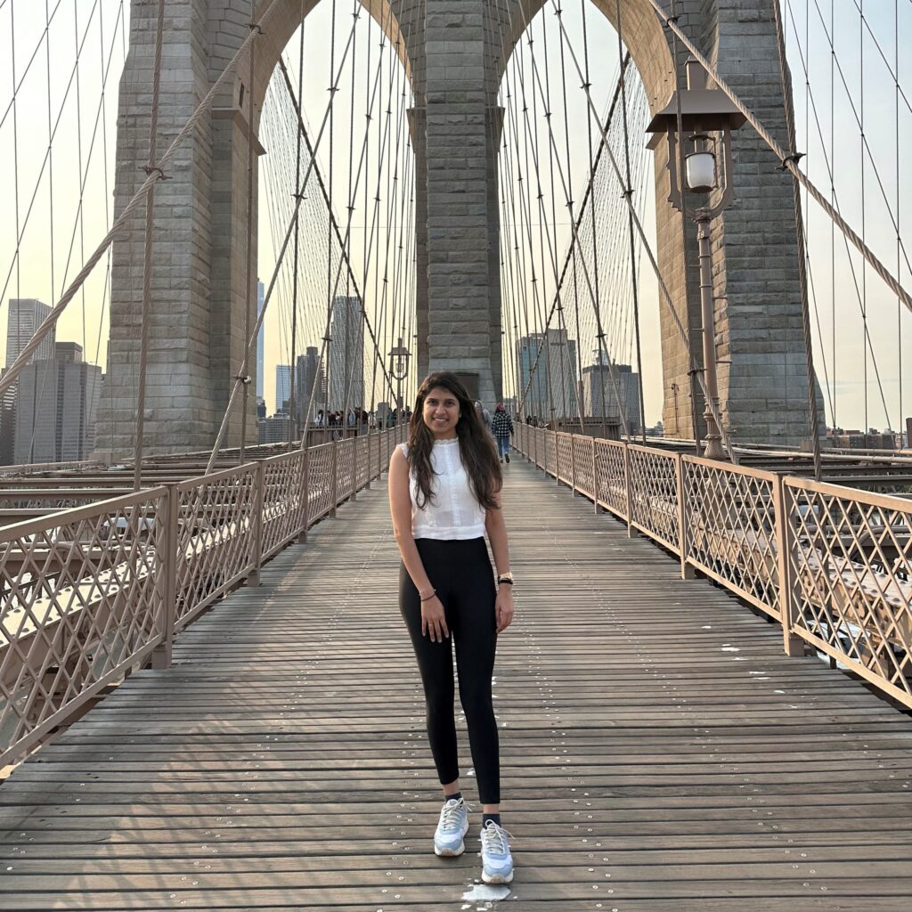 Pooja Shah standing on a bridge