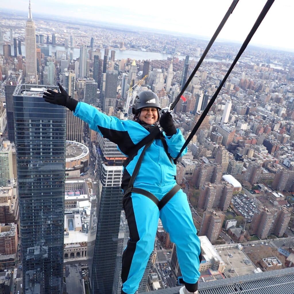 Radhika Patel NYC sky walk on edge of building