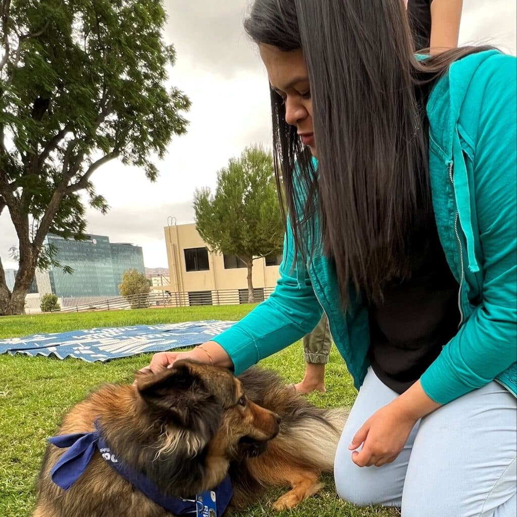 Shravani Bhogate petting her dog