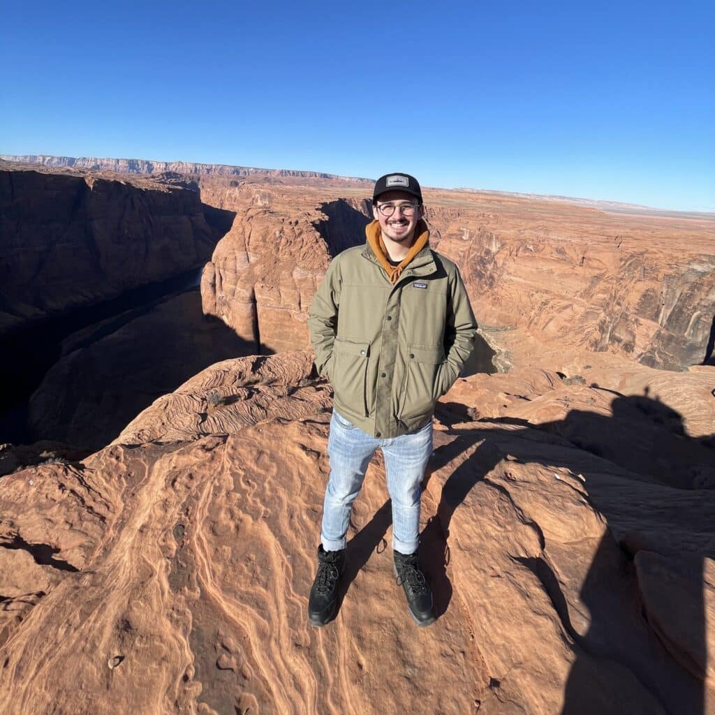 Steven Wechsler standing on a mountain