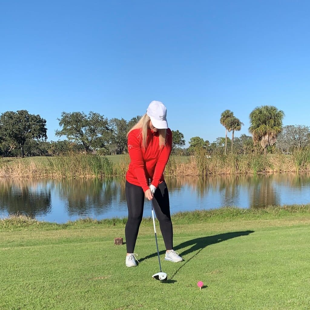 Tori Alexander golfing