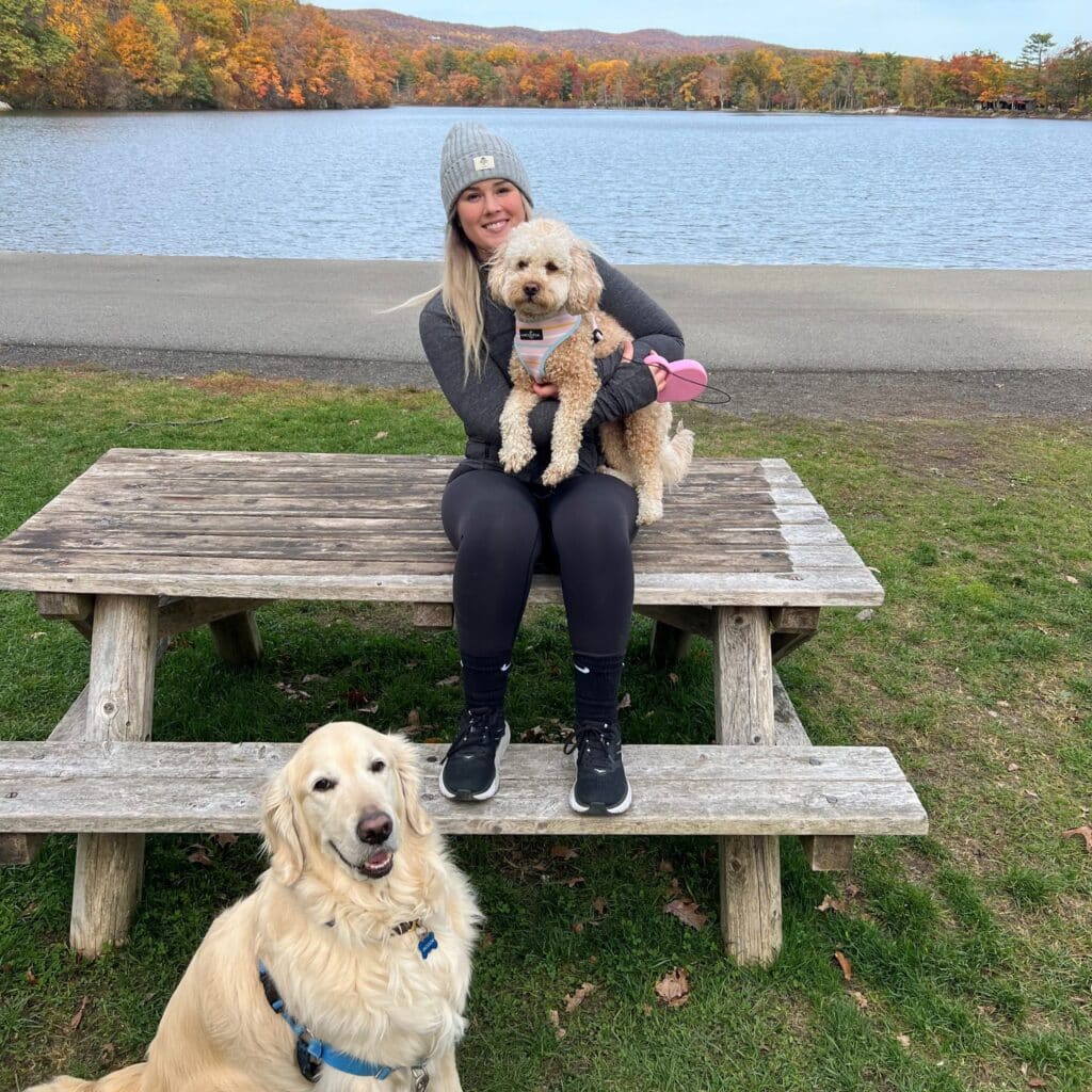 Tori Alexander on bench with dogs