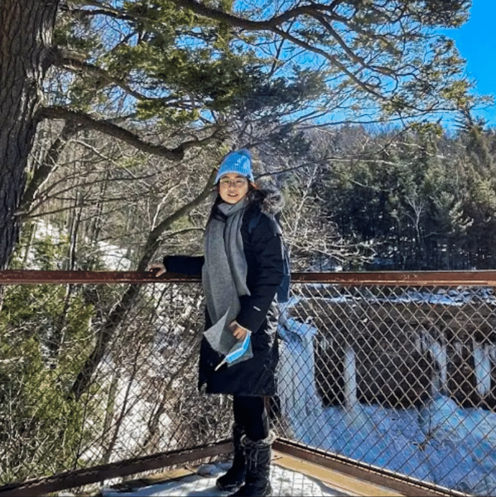 Lauren Chan in Sequoia national park next to large tree