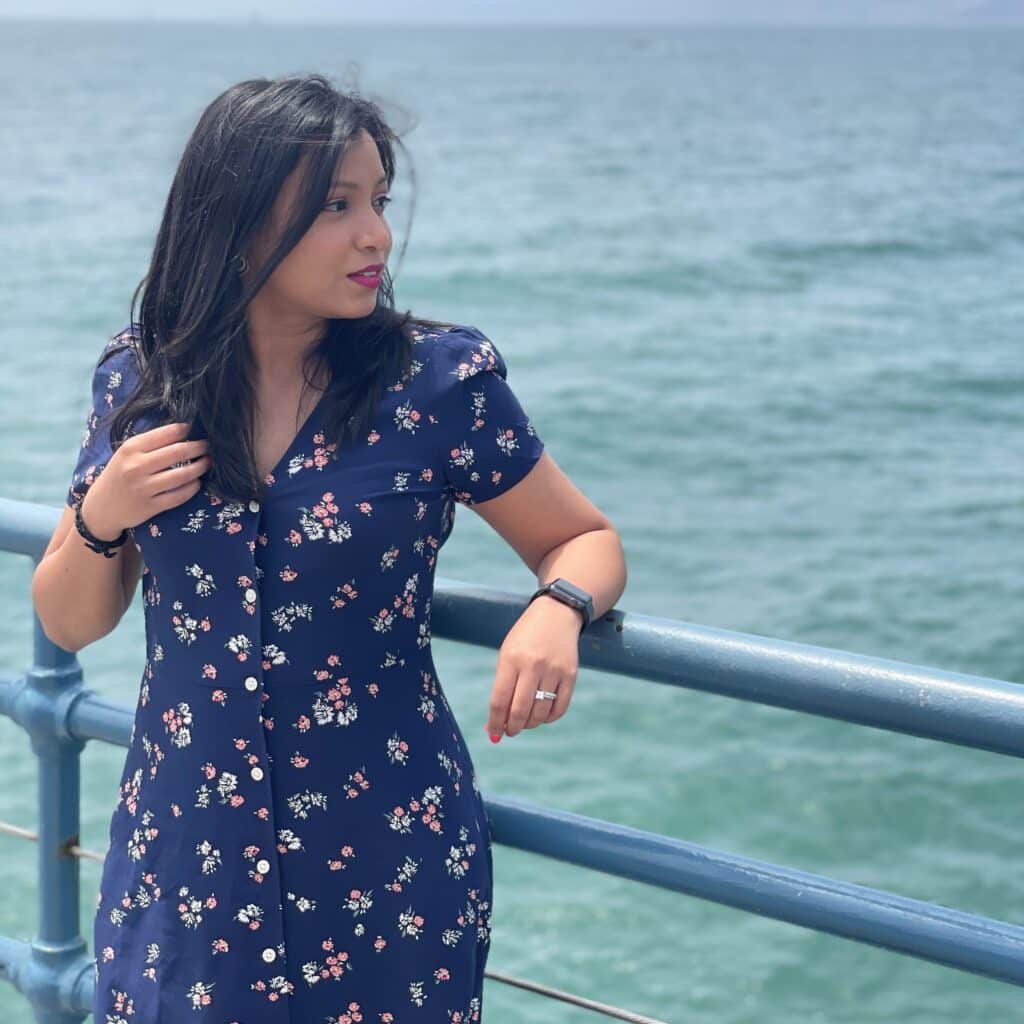 Vrushali Panvelkar portrait on railing by sea