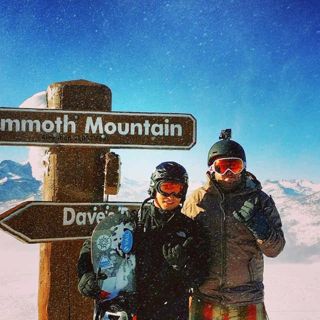 Matthew Hosokawa skiing on top of mountain