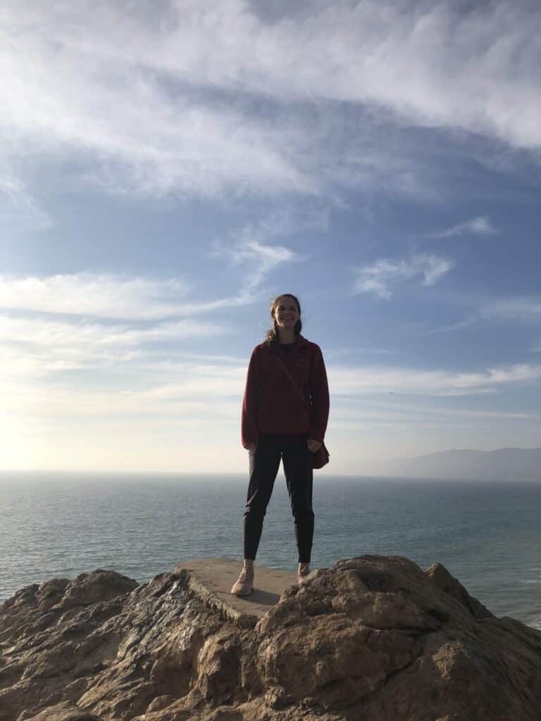 Mary Frances Roebuck travel picture on cliff overlooking the sea