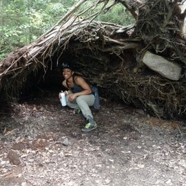 Anika Rivera outdoors under trees roots