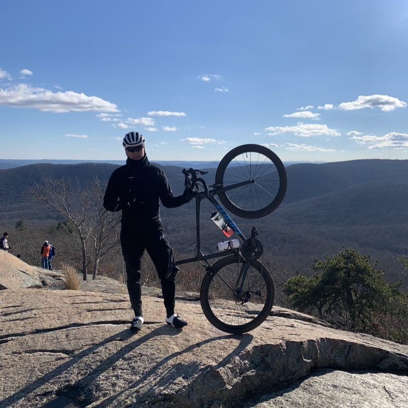 kevin wong biking on a mountain