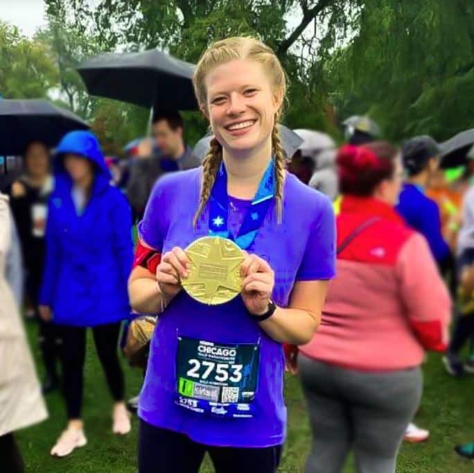 Jennifer Baudhuin with medal after marathon