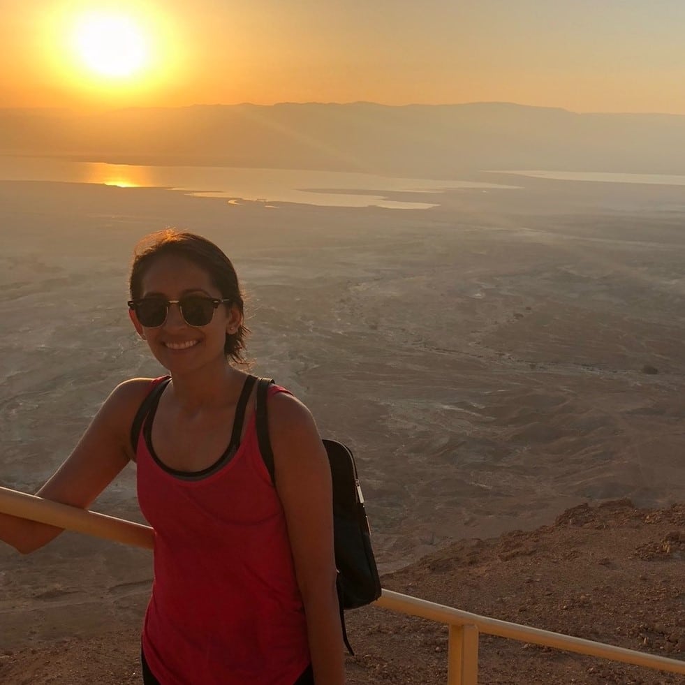 Sheena Shah on mountain top during sunset