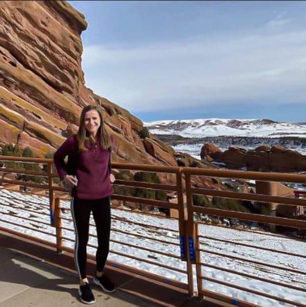 Laura Moran travel picture in front of snow covered canyon land