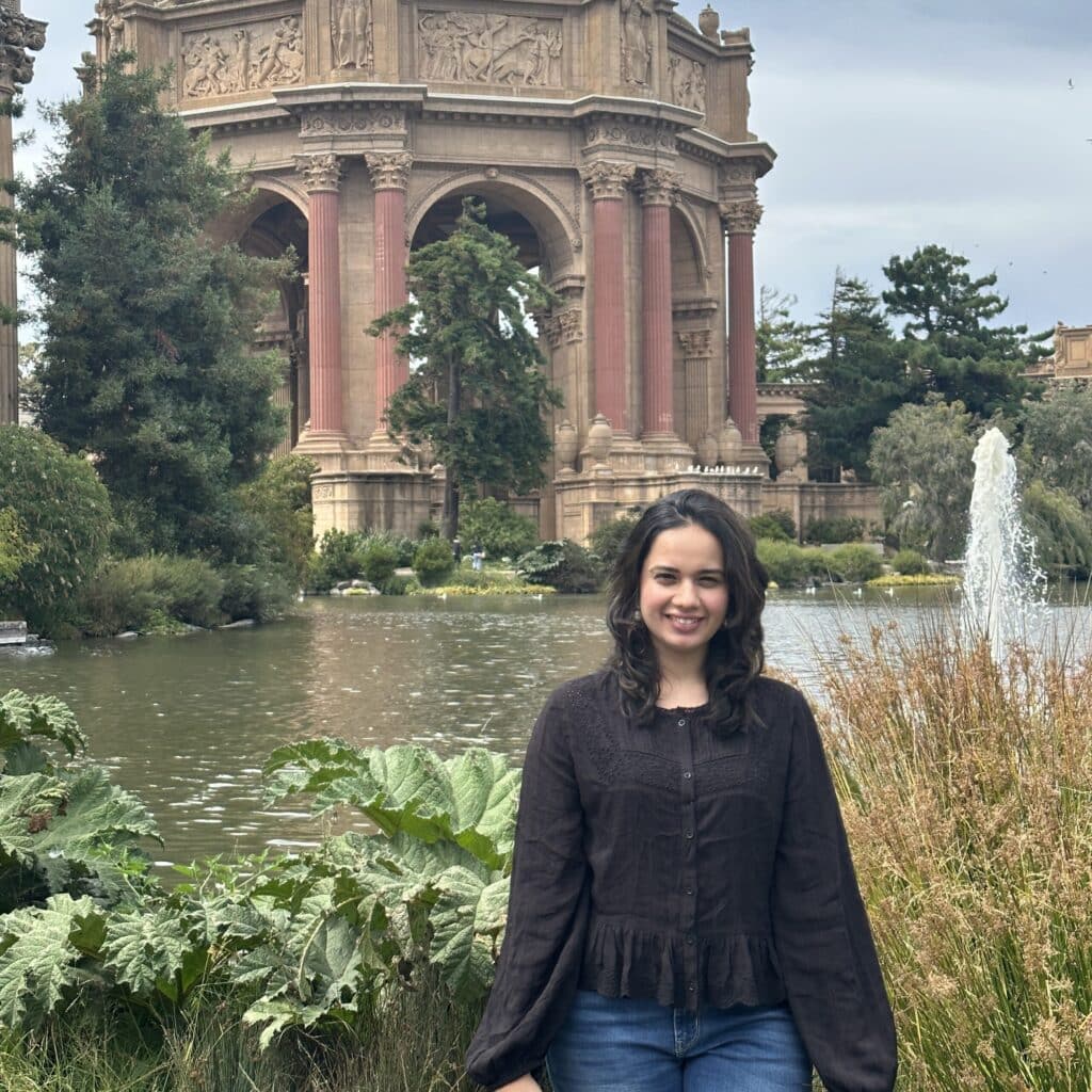 Aashika Shah in front of a pretty water fountain