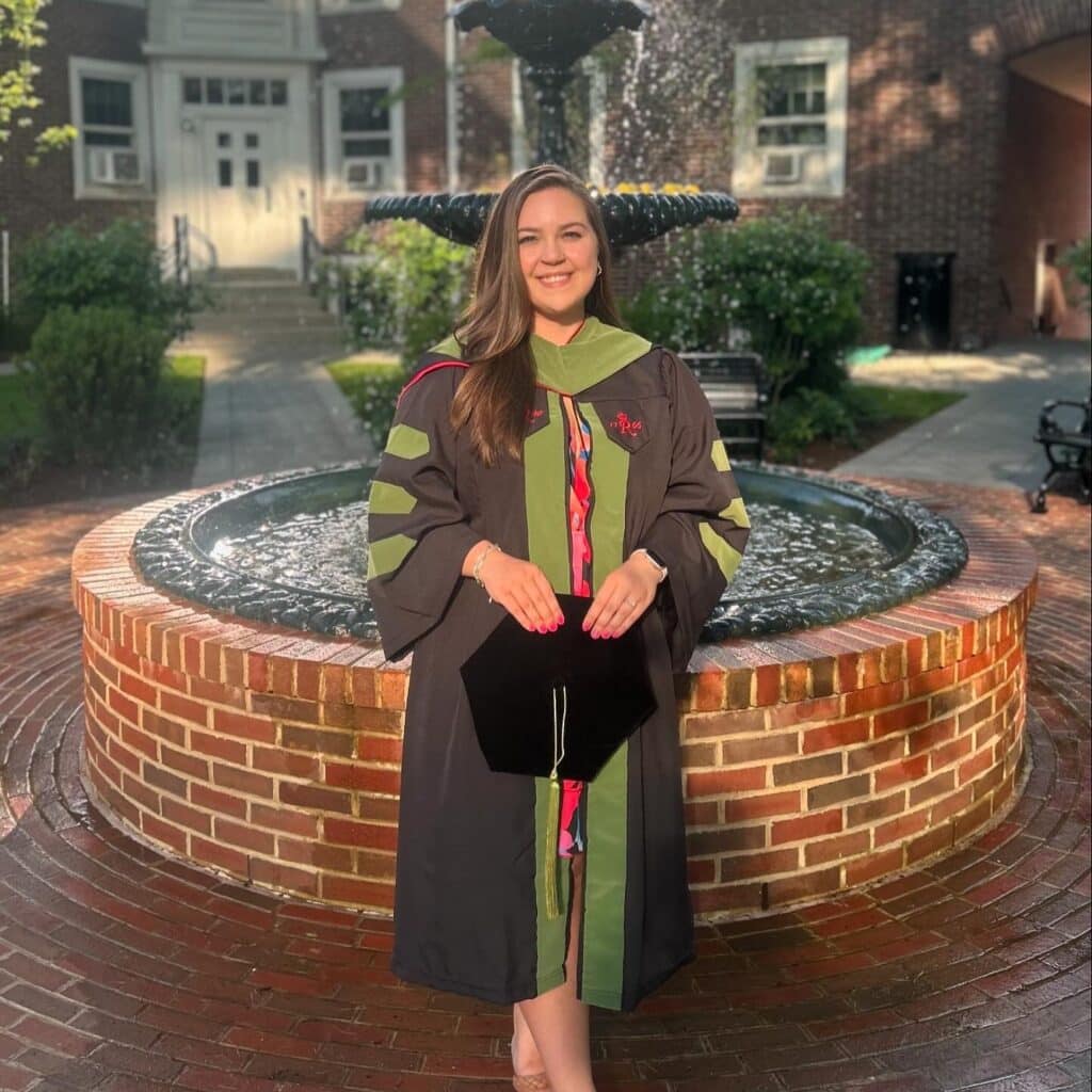 Vanessa Correia taking a graduation photo