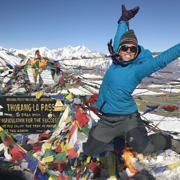 Emily Prader celebrating climbing a mountain