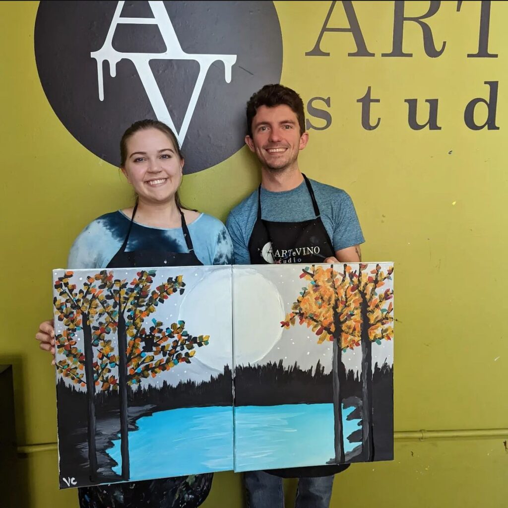 Vanessa Correia holding up her painting