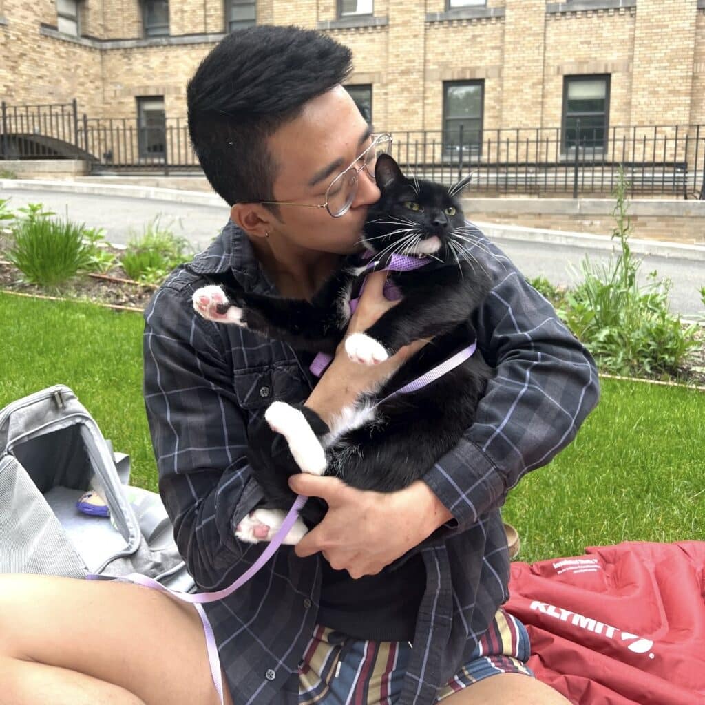 Joren Francisco hugging his cat