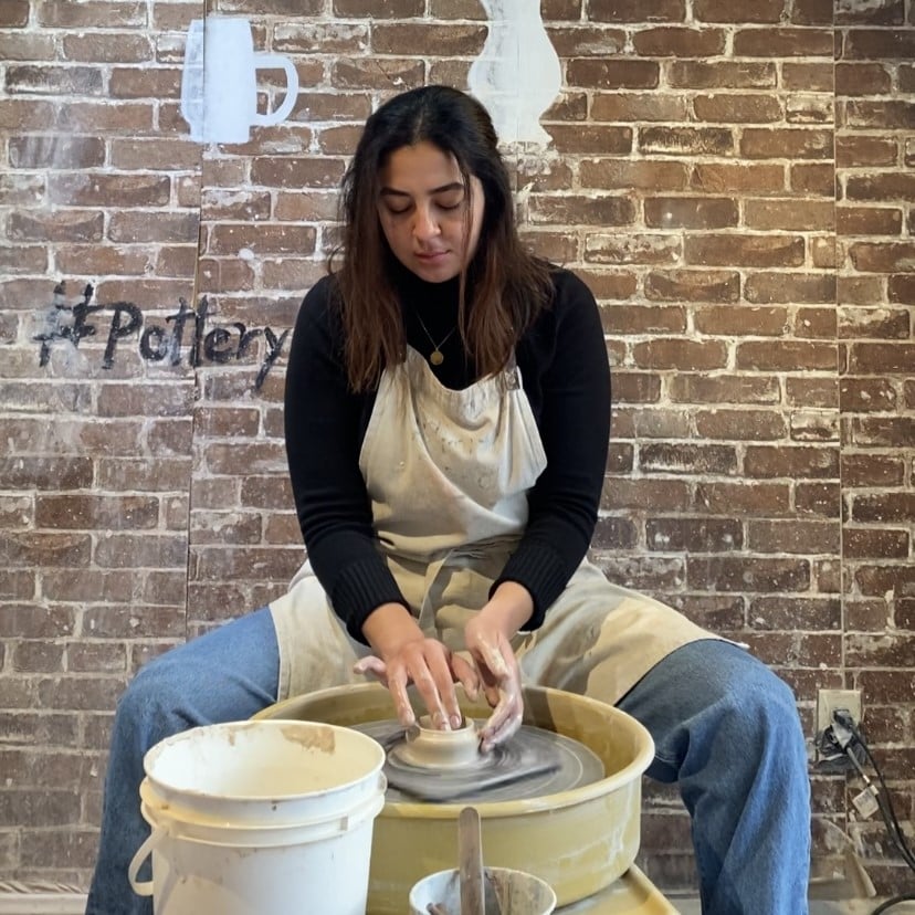 Julia Guzman doing pottery