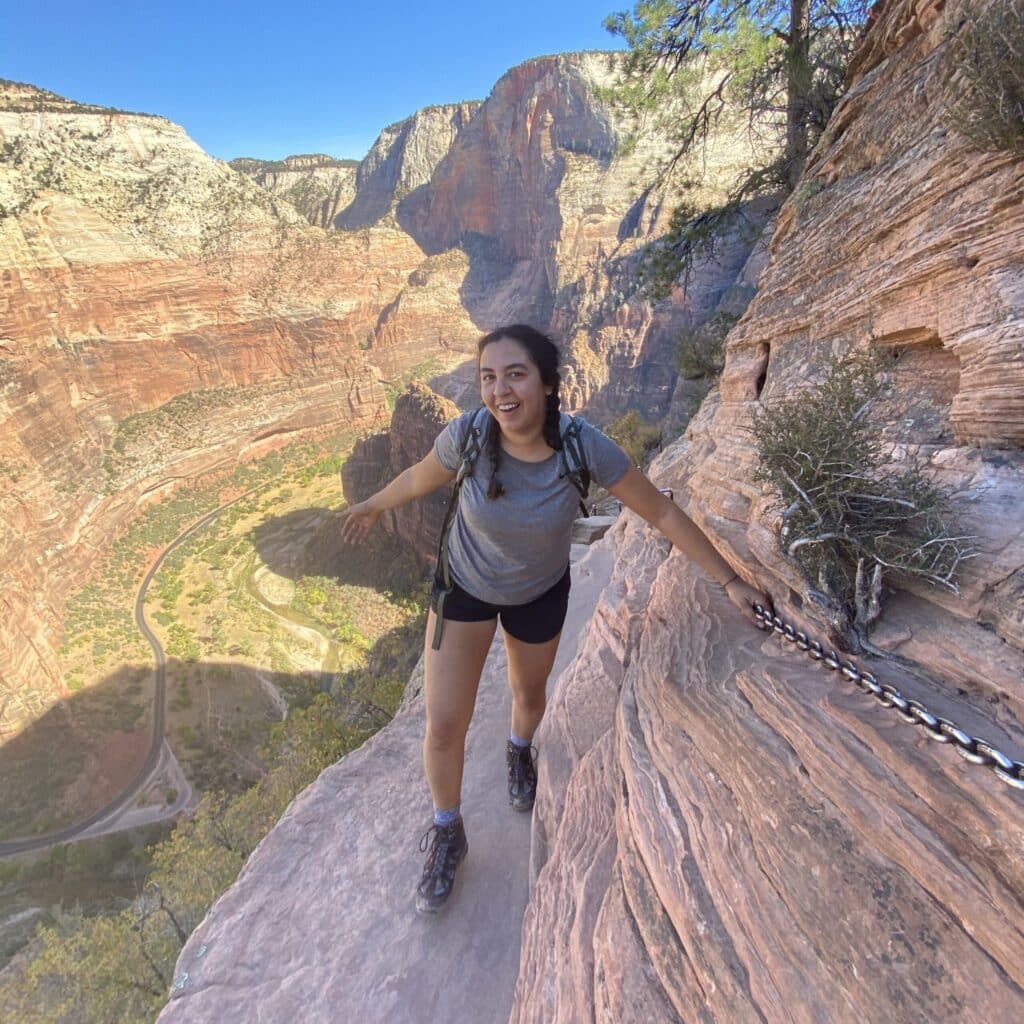 Julia Guzman hiking a mountain