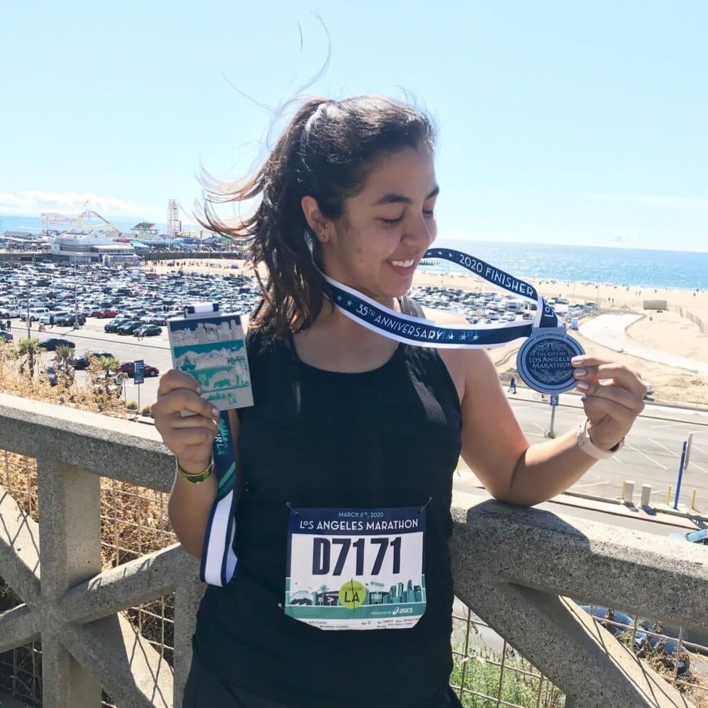 Julia Guzman with a marathon medal