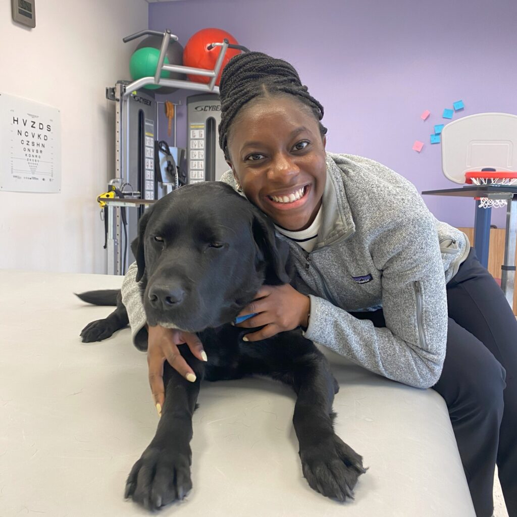 Sabrina Philippe hugging a dog