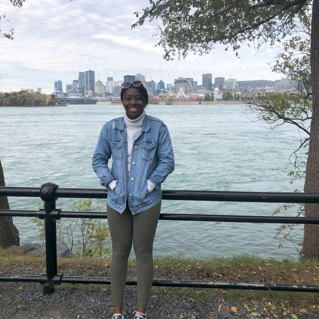 Sabrina Philippe standing in front of a scenic overlook